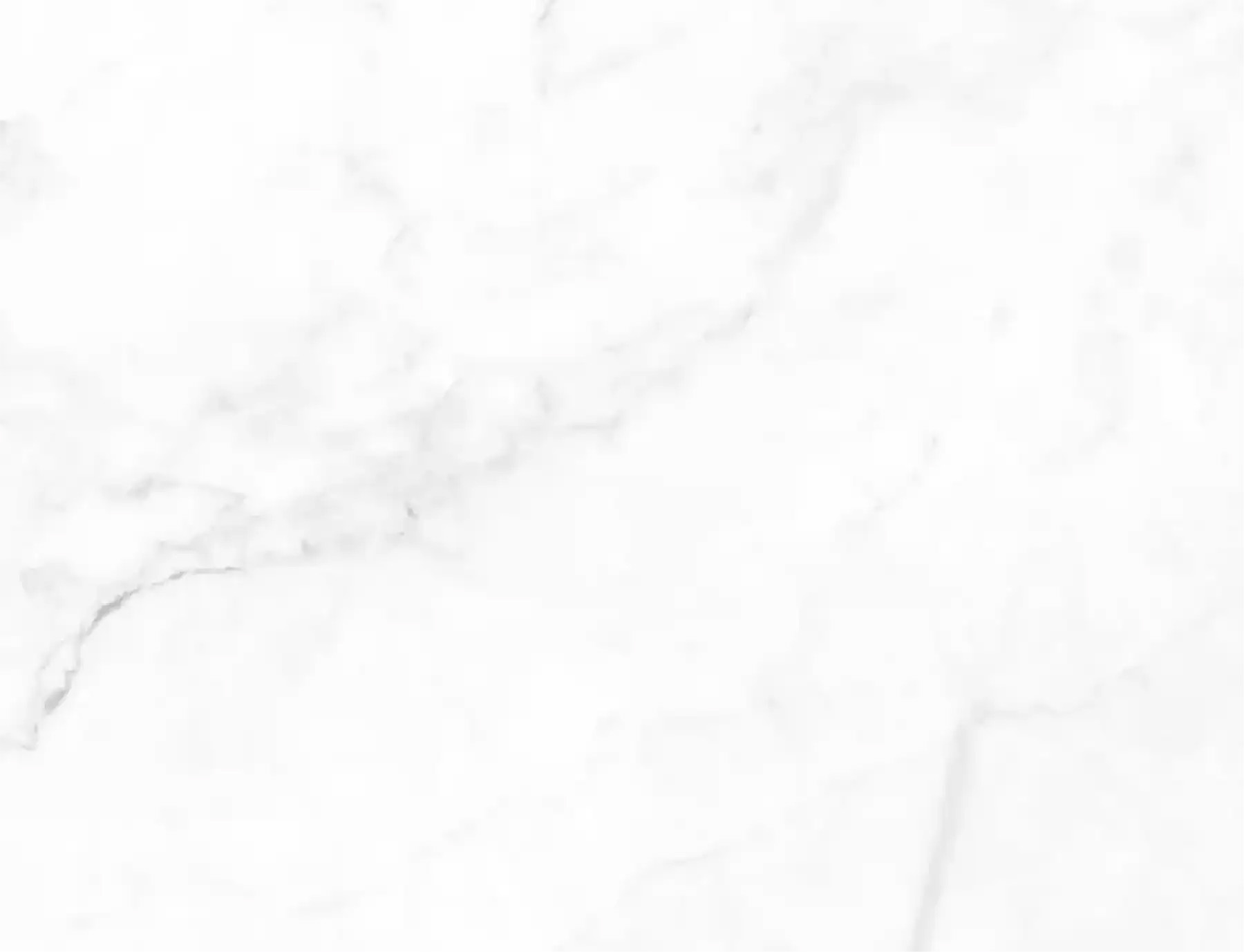 The image shows a close-up view of a marble countertop with a white background, emphasizing the texture and pattern of the marble surface.