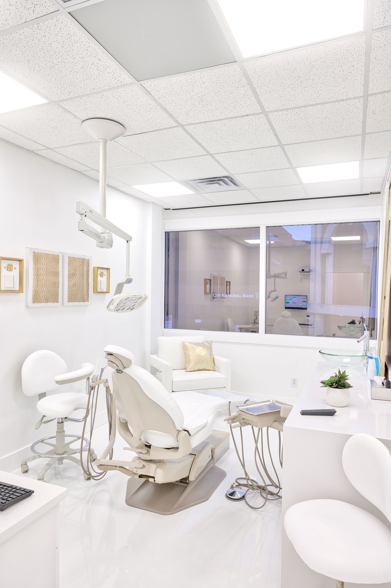 Dental office interior with modern equipment and furniture.