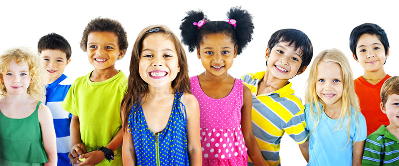 The image shows a group of children with diverse skin tones, wearing colorful clothing, posing for a photo with smiles on their faces.